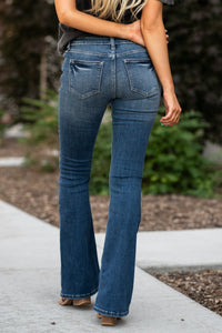 KanCan Jeans  Don't be afraid to wear flares again, not when they look this good! These mid-rise flare jeans hit at exactly the right spot on your waist and with some spandex, these will stretch as you wear and get super comfy!   KanCan Stretch Level: Comfort Stretch   Collection: Core Style  Color: Light Blue Wash Cut: Flare, 33.75" Inseam  Rise: Mid-Rise, 9" Front Rise 68% COTTON , 30% POLYESTER , 2% SPANDEX Fly: Zipper Style #: KC6102M