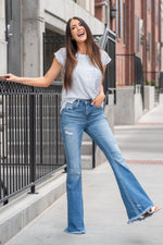 VERVET by Flying Monkey Jeans  Comfort-stretch denim, high rise waist, bell-bottom style, zipper fly closure, whiskering, and a fray hem. Skinny, 34" Inseam* Rise: High Rise, 10.25" Front Rise* 93% COTTON 5% POLYESTER 2% SPANDEX Stitching: Classic Fly: Zipper Fly  Style #: V2662 Contact us for any additional measurements or sizing.    *Measured on the smallest size, measurements may vary by size. 
