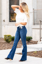Cello Jeans Get comfortable and trendy in these ultra stretchy jeans. The dark wash flared jegging features a flattering flared fit, a faded wash, and light whisker detail. Additionally it has two faux front pockets and two back real pockets. Collection: Spring 2021 Pull On Flare  Color: Dark Blue Wash  Cut: Flare, 33" Inseam Rise: Mid Rise, 8.5" Front Rise 57% Cotton 26.4% Polyester 14.2% Rayon 2.4% Spandex Fly: Zipper Style #: AB35324DK Contact us for any additional measurements or sizing.