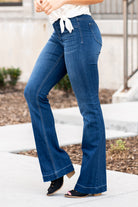 Cello Jeans Get comfortable and trendy in these ultra stretchy jeans. The dark wash flared jegging features a flattering flared fit, a faded wash, and light whisker detail. Additionally it has two faux front pockets and two back real pockets. Collection: Spring 2021 Pull On Flare  Color: Dark Blue Wash  Cut: Flare, 33" Inseam Rise: Mid Rise, 8.5" Front Rise 57% Cotton 26.4% Polyester 14.2% Rayon 2.4% Spandex Fly: Zipper Style #: AB35324DK Contact us for any additional measurements or sizing.