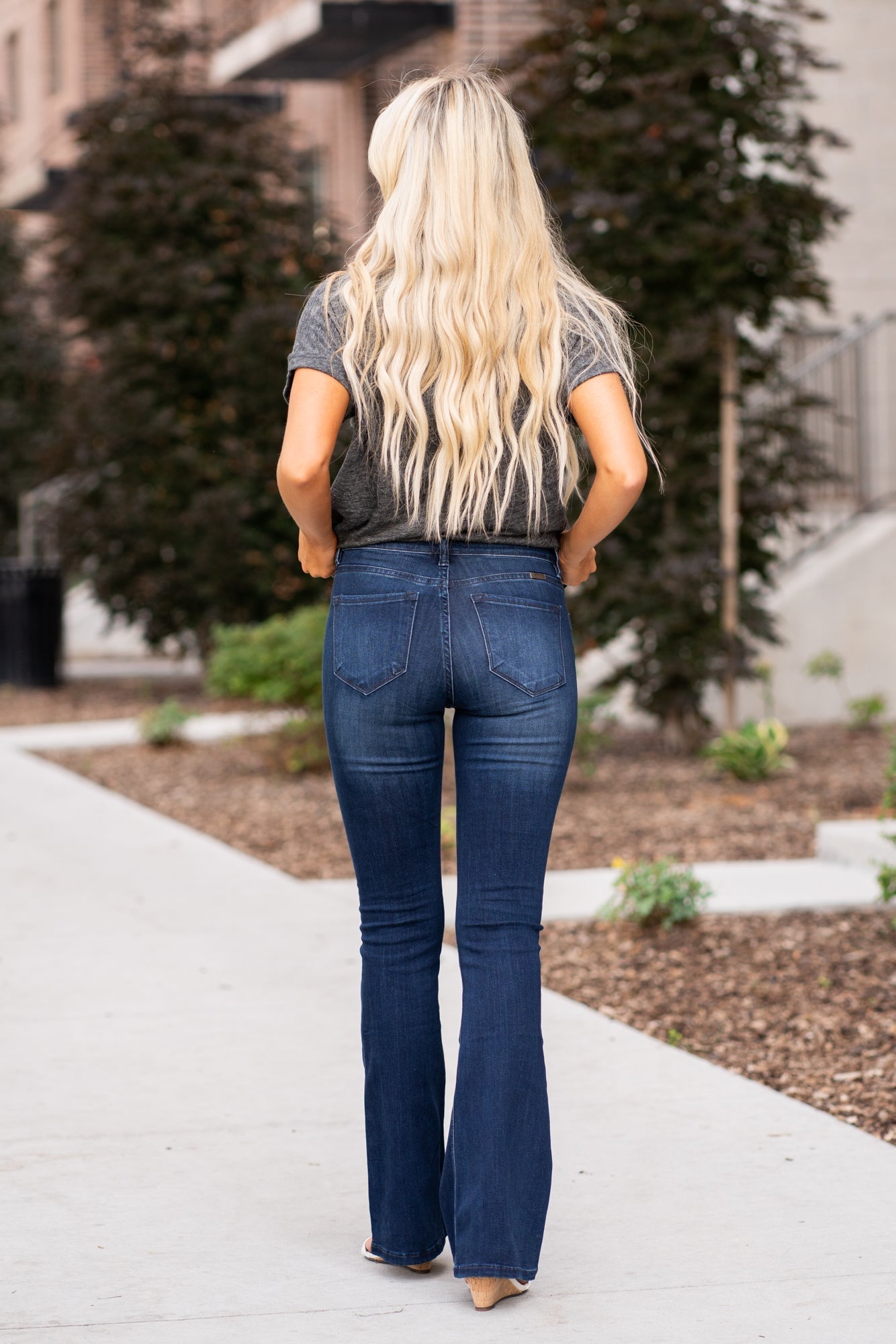 KanCan Jeans Collection: Core Style  Color: Dark Wash Cut: Flare, 31.5" Inseam  Rise: Mid-Rise, 9" Front Rise 54% COTTON 34% Rayon 10% POLYESTER 2% SPANDEX Fly: Zipper Style #: KC6102D-PT Contact us for any additional measurements or sizing.  Haley wears a size small top, a 1 in jeans and a small in tops. She is wearing a size 24/1 in these jeans.