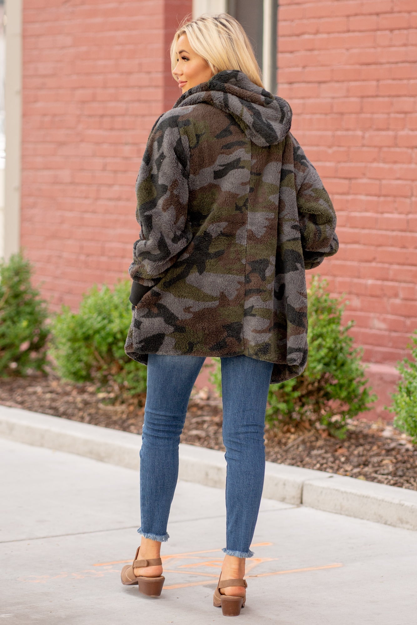 Hem & Thread   This camo print is too cute. Pair with a great boyfriend denim in heels for a trendy fun look.  Collection: Winter 2020 Color: Camouflage  Neckline: Open  Sleeve: Long 100% POLYESTER Style #: 8433F-Camo Contact us for any additional measurements or sizing.