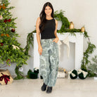 Show out in our Xena High Rise Camo Horseshoe Jeans — a bold, sculptural silhouette that instantly elevates any outfit. Designed to sit comfortably at the high rise, this horseshoe shape curves wide through the thigh, then narrows back in toward the ankle for that oversized, baggy-but-polished look everyone’s obsessed with.

The allover camo print adds a street-style twist while still feeling wearable for everyday fits. Finished with a classic single-button closure, zip fly, and traditional 5-pocket styling
