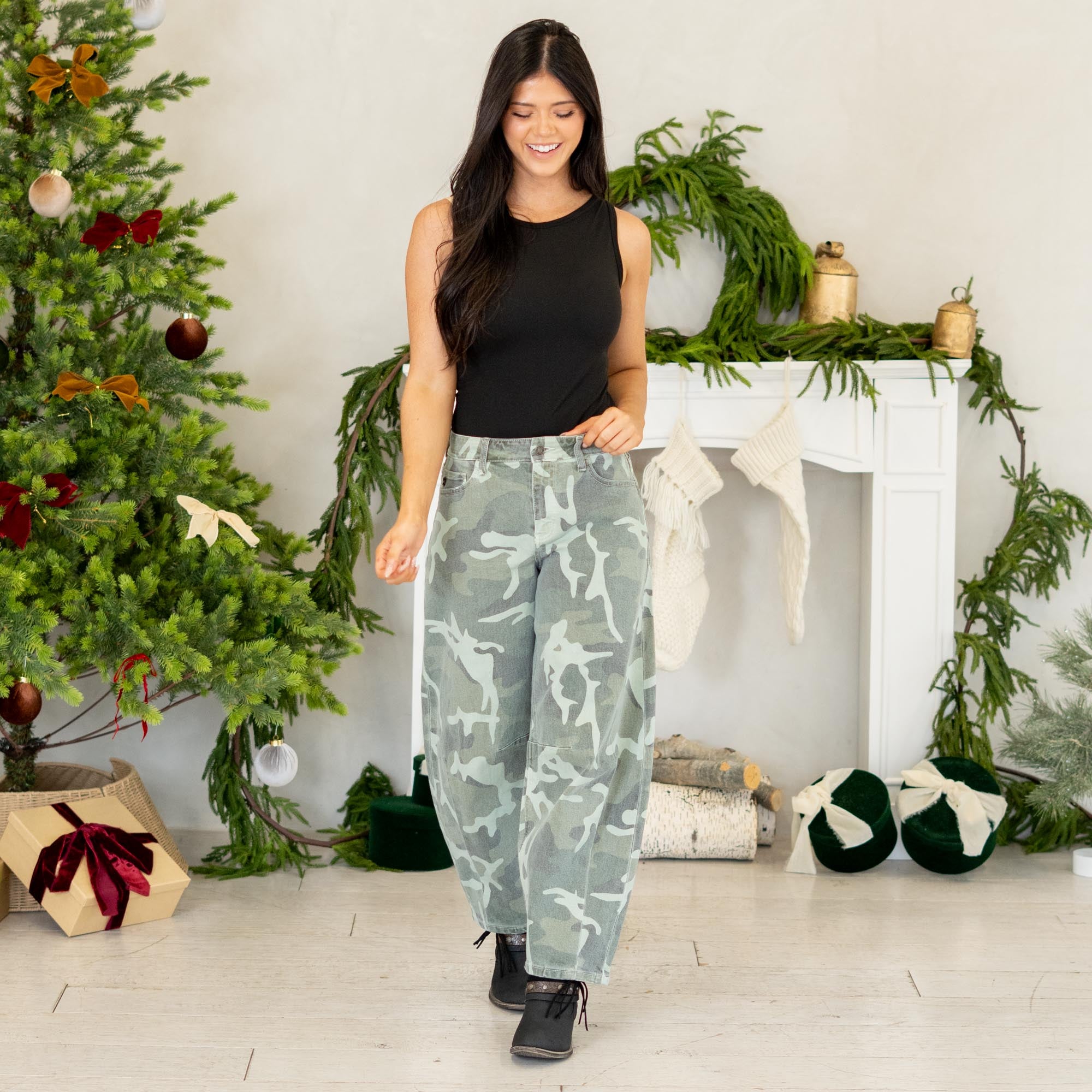 Show out in our Xena High Rise Camo Horseshoe Jeans — a bold, sculptural silhouette that instantly elevates any outfit. Designed to sit comfortably at the high rise, this horseshoe shape curves wide through the thigh, then narrows back in toward the ankle for that oversized, baggy-but-polished look everyone’s obsessed with.

The allover camo print adds a street-style twist while still feeling wearable for everyday fits. Finished with a classic single-button closure, zip fly, and traditional 5-pocket styling
