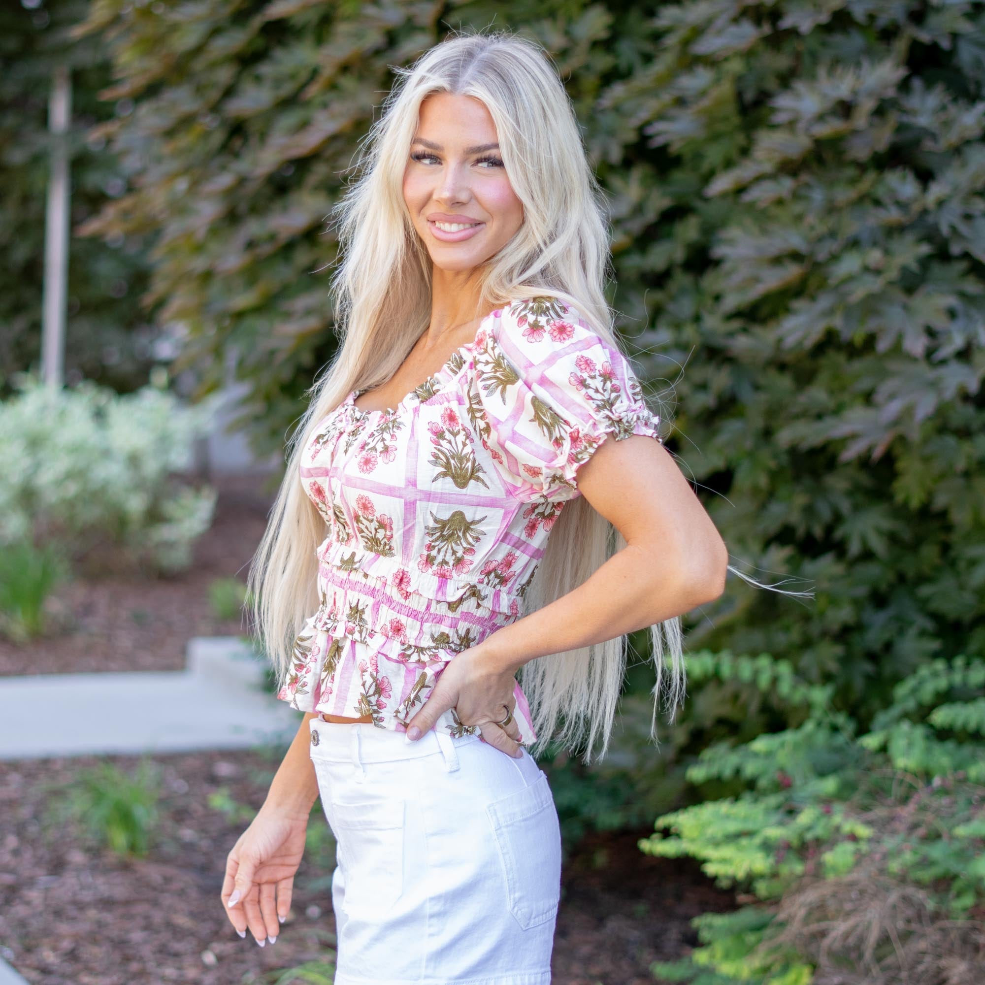 Hem &amp; Thread

Sweet, feminine, and effortlessly charming. This floral gingham blouse features puff sleeves, a flattering square neckline, and a smocked bodice that hugs in all the right places. Finished with a soft ruffled hem, it’s the perfect top for pairing with your favorite denim.

Round Neckline&nbsp;
90% RAYON 10% NYLON&nbsp;
37890-Pink

Contact us for any additional measurements or sizing.&nbsp;