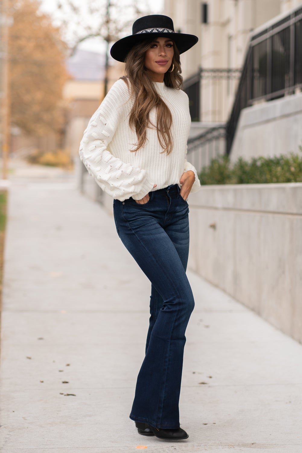 KanCan Jeans Collection: Core Style  Color: Dark Wash Cut: Flare, 33.75" Inseam  Rise: Mid-Rise, 9" Front Rise 54% 54% COTTON 34% Rayon 10% POLYESTER 2% SPANDEX Fly: Zipper Style #: KC6102D Contact us for any additional measurements or sizing.  Taylor is 5'7" and wears a size 4 in jeans, small top and an 8.5 in shoes. She is wearing a size size 25/3 in these jeans.