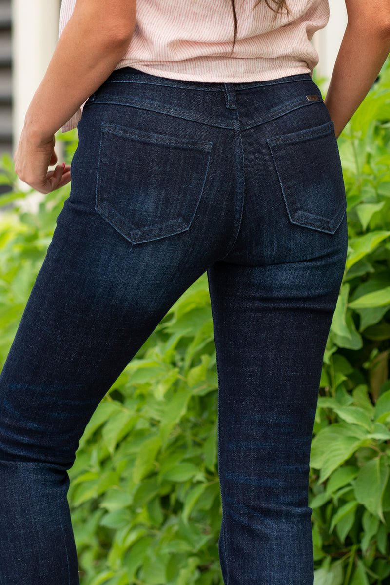 KanCan Jeans  KanCan Stretch Level: Comfort Stretchy  Color: Dark Blue Cut: Boot Cut, 31" Inseam* Rise: High-Rise, 9.5" Front Rise* 94.3% COTTON , 4.9% T400 , 0.8% SPANDEX Stitching: Classic  Fly: Exposed Button Fly Style #: KC7348D Contact us for any additional measurements or sizing.  *Measured on the smallest size, measurements may vary by size.