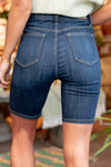 Judy Blue Jeans Color: Dark Blue Shorts  Cut: Biker Shorts, 8.5" Inseam* High Rise: 10.5" Front Rise* 52.2%Cotton / 21.5% Rayon / 23.4% Poly / 2.9%Lycra Stitching: Classic  Fly: No fly, Pull On Style #: JB150159 | 150159 Contact us for any additional measurements or sizing.   *Measured on the smallest size, measurements may vary by size.  Sarah wears a size 25 in jeans, a small in tops, and 8 in shoes. She is wearing size small in these shorts. 
