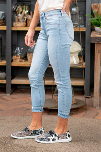 KanCan Jeans  These high-rise skinny jeans hit exactly the right spot on your waist and with some spandex, these will stretch as you wear and get super comfy!  Color: Light Blue Wash Cut: Crop Skinny, 24.5" Inseam* Rise: High Rise, 10" Front Rise* 93% COTTON, 5% POLYETHYLENE,2% SPANDEX Stitching: Classic Fly: Zipper  Style #: KC2556L Contact us for any additional measurements or sizing. 