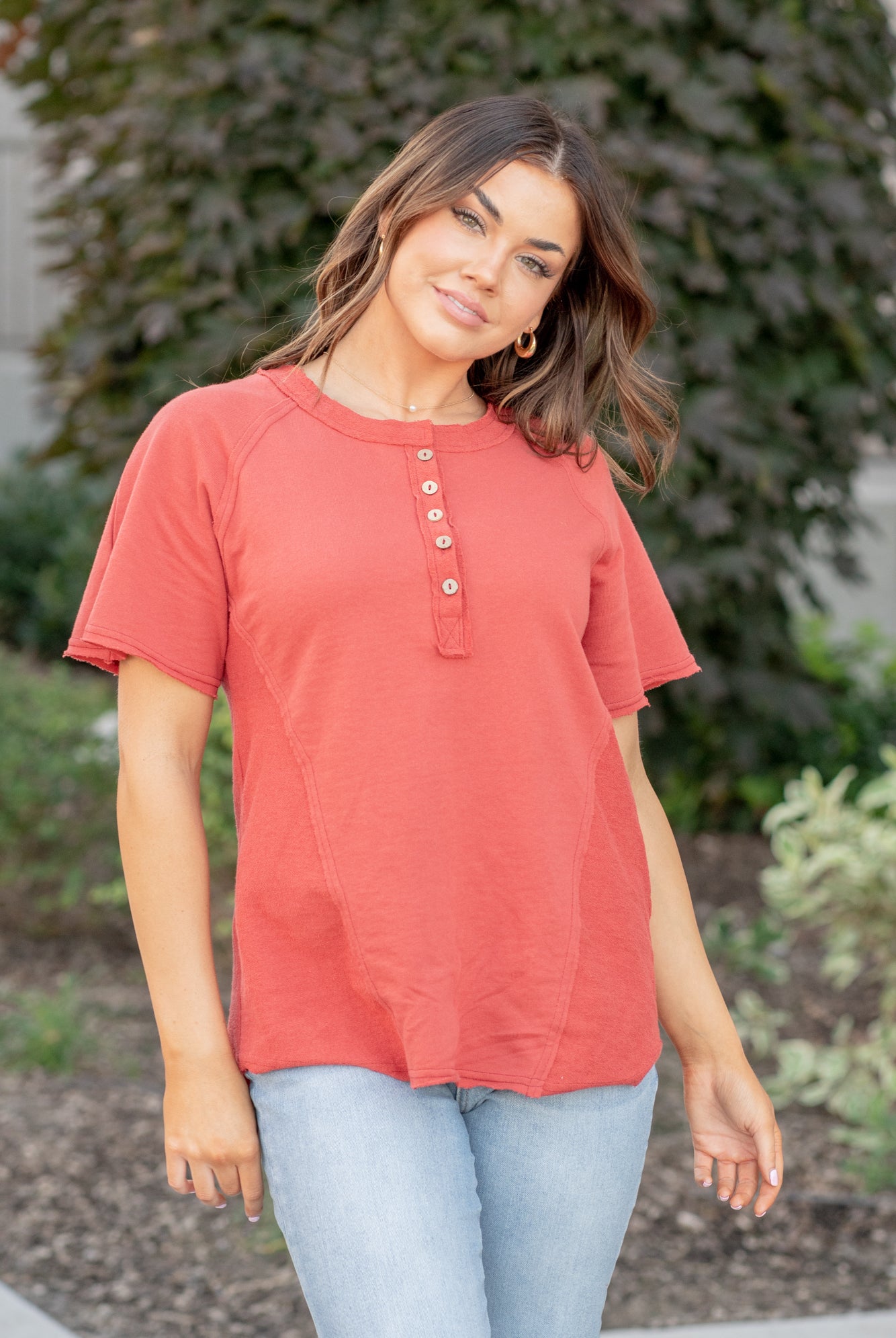 This short sleeve Henley top is great for layering up or down during winter and pairs well with any denim.  Color: Red Brick Button Up Front Henley Raglan Top Neckline: Round Sleeve: Short Sleeve 80% COTTON 20% POLYESTER Style #: FBT7658-A19-BrickRed Contact us for any additional measurements or sizing.