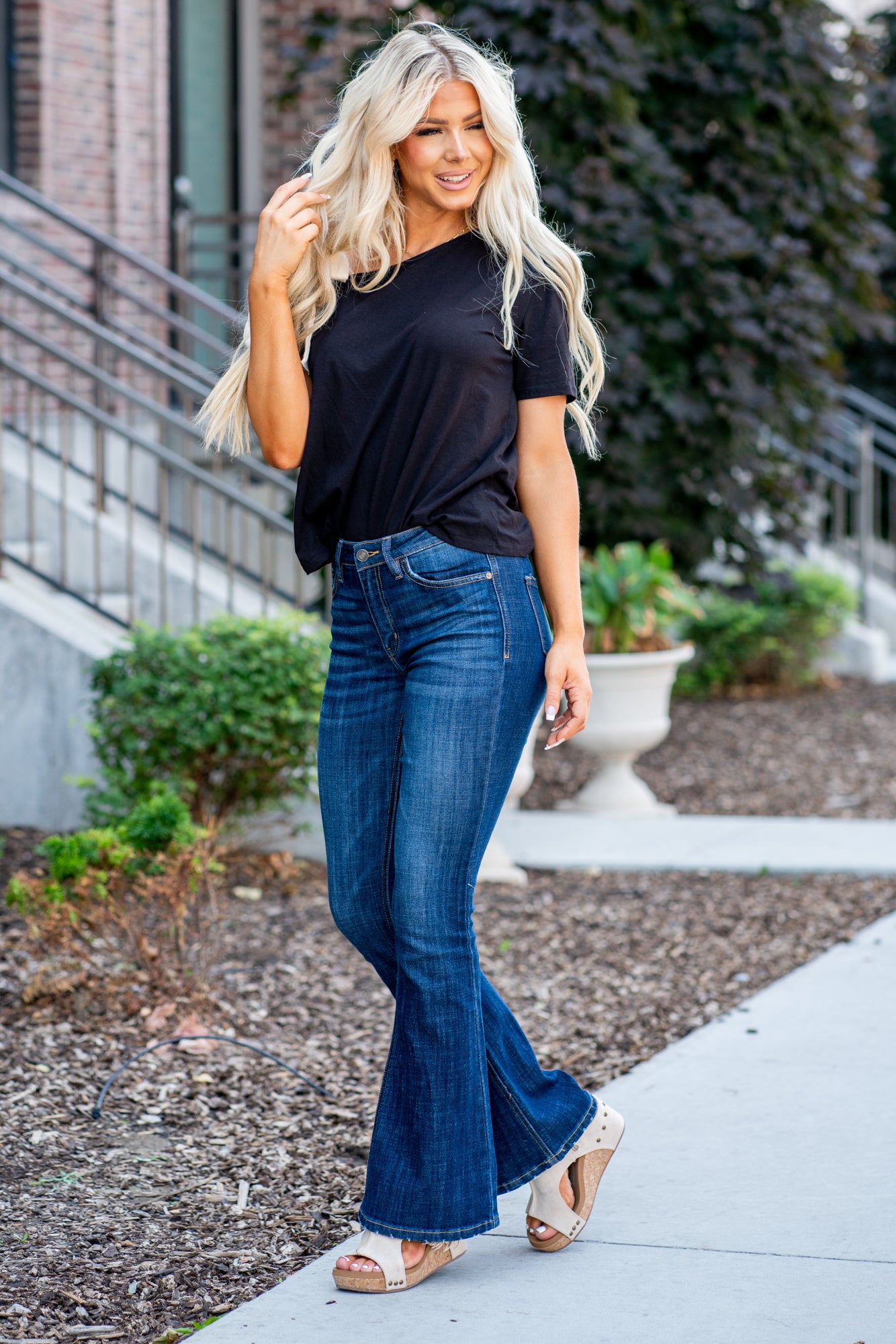 KanCan Jeans Collection: Core Style    Color: Dark Wash Cut: Flare, 33.75" Inseam* Rise: Mid-Rise, 9" Front Rise* 54% 54% COTTON 34% Rayon 10% POLYESTER 2% SPANDEX Fly: Zipper Style #: KC6102LOH Contact us for any additional measurements or sizing.    *Measured on the smallest size, measurements may vary by size.      Cas is 5'7" and wears a size 25 in jeans, a small in tops, and 8 in shoes. She is wearing size 25 in these jeans. 