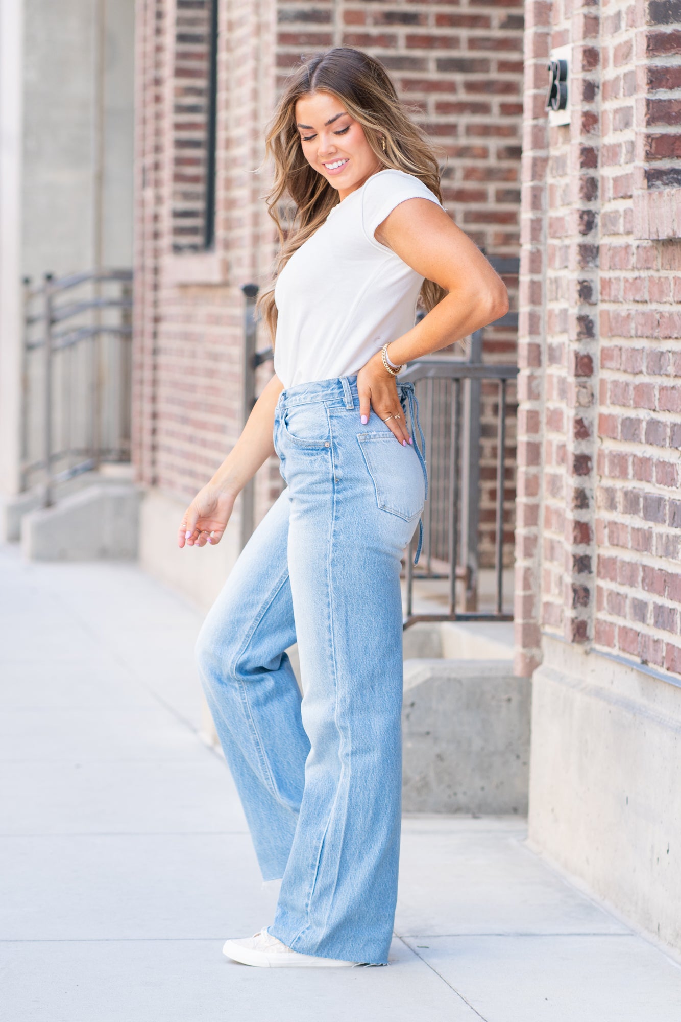 KanCan Jeans  KanCan Rigid Denim  Flare, 32" Inseam  High Rise, 12" Front Rise Light Blue Wash  100% Cotton Fly: Exposed Button Style #: KC8725L Contact us for any additional measurements or sizing.  *Measured on the smallest size, measurements may vary by size.  Jacquelyn wears a size 25 in jeans, a small in tops, and 6.5 in shoes. She is wearing a size 25 in these jeans.