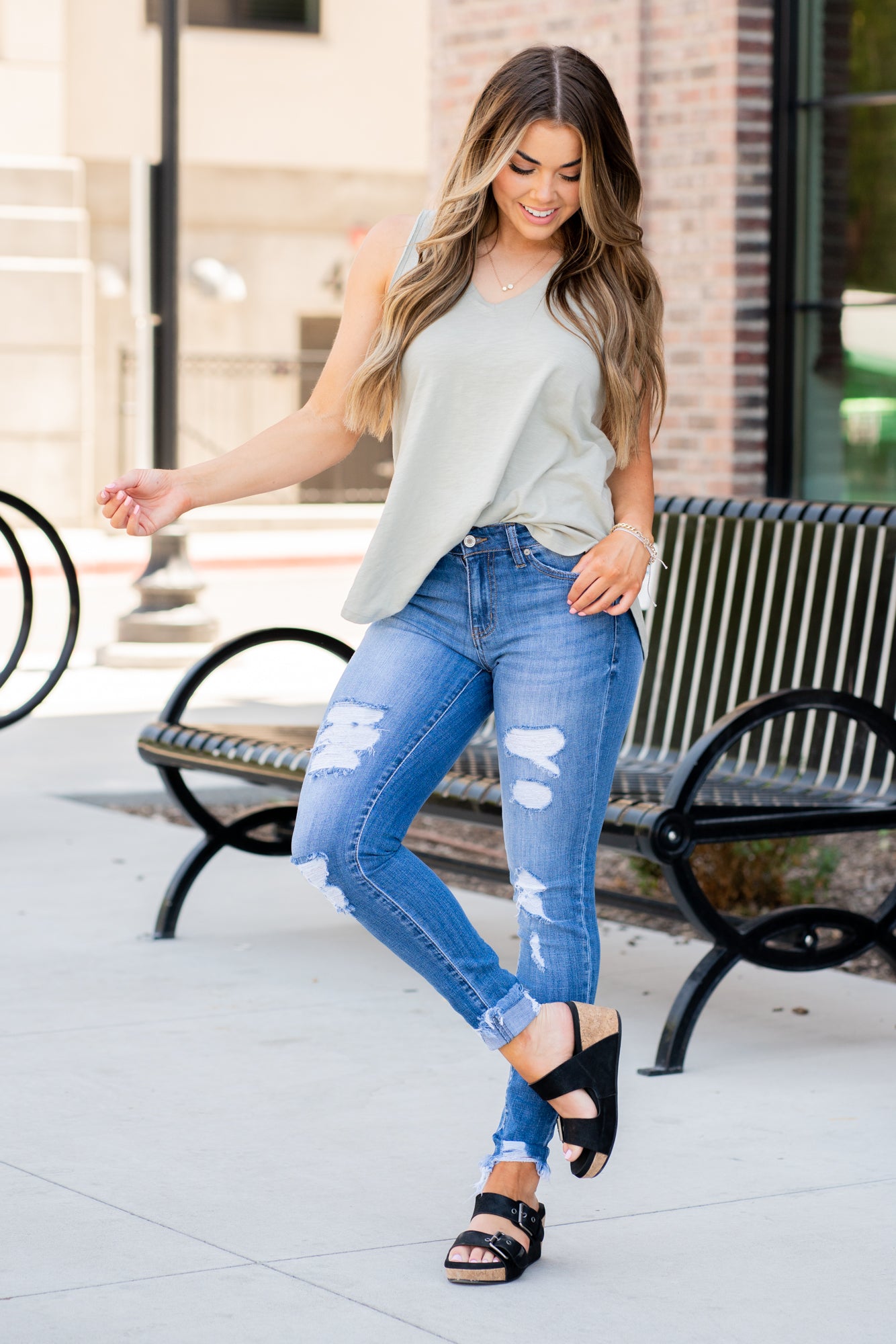 KanCan Jeans Collection: Core Collection Color: Medium Wash, 99% COTTON 1% SPANDEX Cut: Skinny, 29" Inseam* Rise: Mid-Rise, 8.5" Front Rise* Machine Wash Separately In Cold Water Stitching: Classic Fly: Zipper Style #: KC7103M Contact us for any additional measurements or sizing.  *Measured on the smallest size, measurements may vary by size.    Jacquelyn wears a size 25 in jeans, a small in tops, and 6.5 in shoes. She is wearing size 25 in these jeans.