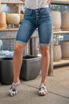 High Rise Button Fly Shorts  By KanCan    High-rise waist, 9.5" Front Rise Cut: Bermudas, 15" Inseam after Double Fold Functional pockets Slim tapered leg with Cuff Whiskered Washed Denim, Dark Wash Material: 92% COTTON, 6% POLYESTER, 2% SPANDEX Stitching: Classic Fly: Exposed Button Fly Style #: KC6312M