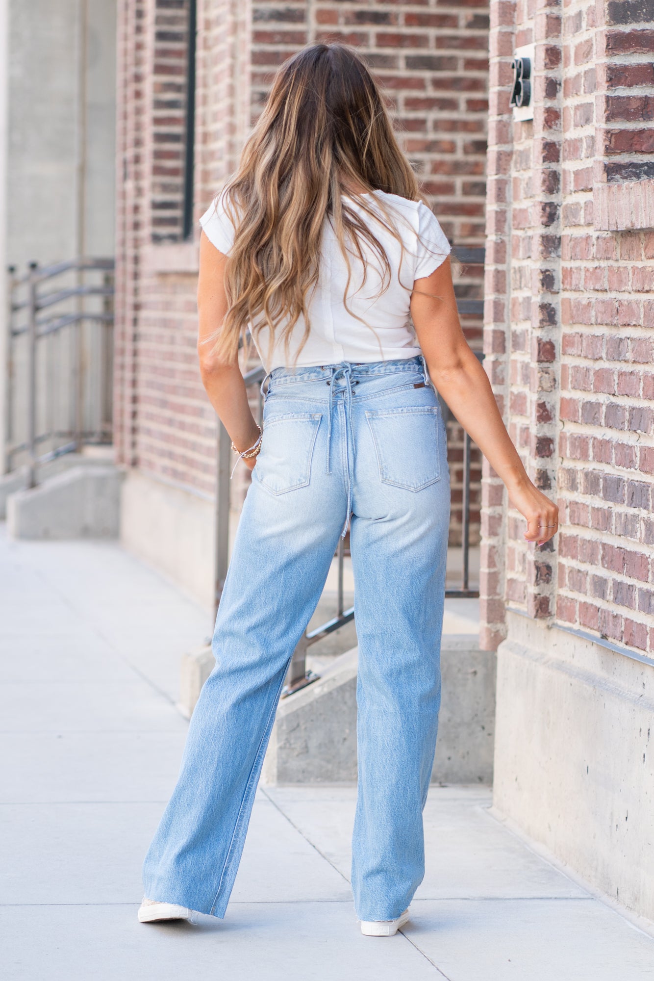 KanCan Jeans  KanCan Rigid Denim  Flare, 32" Inseam  High Rise, 12" Front Rise Light Blue Wash  100% Cotton Fly: Exposed Button Style #: KC8725L Contact us for any additional measurements or sizing.  *Measured on the smallest size, measurements may vary by size.  Jacquelyn wears a size 25 in jeans, a small in tops, and 6.5 in shoes. She is wearing a size 25 in these jeans.