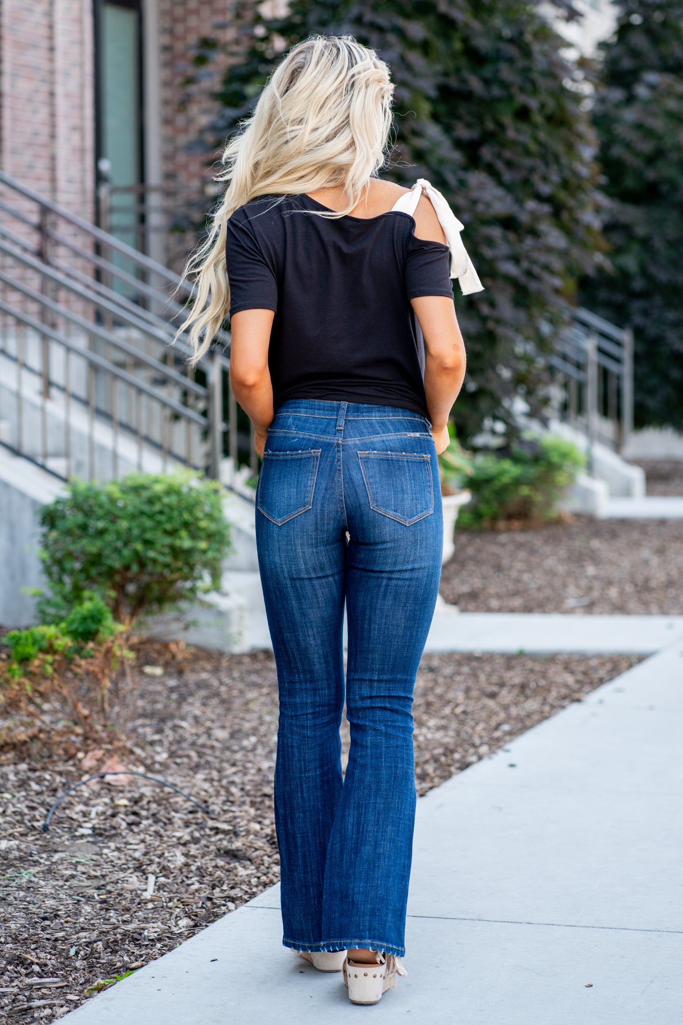 KanCan Jeans Collection: Core Style    Color: Dark Wash Cut: Flare, 33.75" Inseam* Rise: Mid-Rise, 9" Front Rise* 54% 54% COTTON 34% Rayon 10% POLYESTER 2% SPANDEX Fly: Zipper Style #: KC6102LOH Contact us for any additional measurements or sizing.    *Measured on the smallest size, measurements may vary by size.      Cas is 5'7" and wears a size 25 in jeans, a small in tops, and 8 in shoes. She is wearing size 25 in these jeans. 