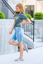 VERVET by Flying Monkey Jeans  These comfortable bermuda shorts have a distressed hem detail. Pair with a graphic tee and sandals. Shorts, 3.5" Inseam*   High Rise, 10" Front Rise* 98% Cotton, 2% Spandex Stitching: Classic Fly: Zipper  Style #: V2929 Contact us for any additional measurements or sizing.    *Measured on the smallest size, measurements may vary by size. 