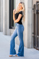 KanCan Jeans  You will love the way these flare cuts fit your curves. Dress up with heels and a cute flutter sleeve top for a night out.  Color: Medium Blue Cut: Flare Cut, 34" Inseam* Rise: High-Rise, 11" Front Rise* 98% COTTON, 2% SPANDEX Stitching: Classic Fly: Zipper Style #: KC9322M Contact us for any additional measurements or sizing. 