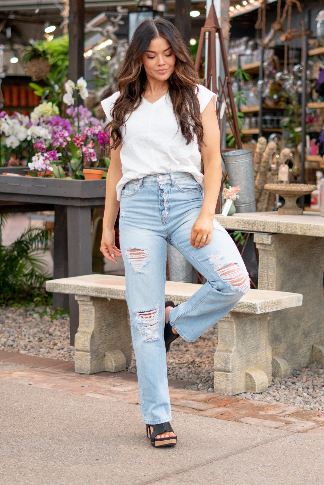 KanCan Jeans  With a high waist and straight fit, these will be your go-to jeans that will never go out of style. Color: Medium Blue  Cut: Straight Fit, 31" Inseam* Rise: High-Rise, 12.5" Front Rise* 100% Cotton, Rigid Denim Fly: Exposed Button Fly Style #: KC7912L Contact us for any additional measurements or sizing.  *Measured on the smallest size, measurements may vary by size.  Jacquelyn wears a size 25 in jeans, a small in tops, and 6.5 in shoes. She is wearing size 25 in these jeans.