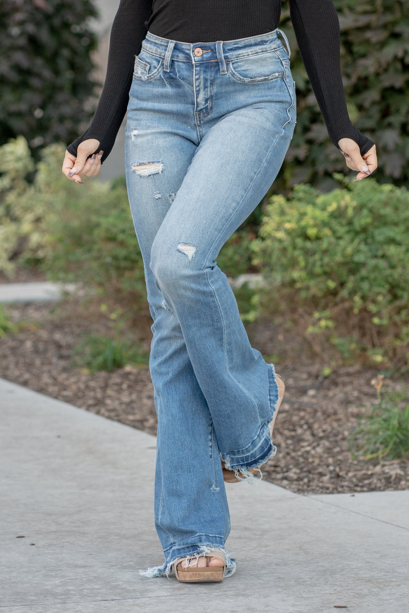VERVET by Flying Monkey Jeans  This flare features a high rise with single button closure and a 34" inseam for length.  Flare, 34" Inseam*  Rise: High Rise, 10" Front Rise* Leg Opening: 21"* 93% COTTON , 5% POLYESTER , 2% SPANDEX Stitching: Classic  Fly: Zip Fly  Style #: T5435 *Measured on the smallest size, measurements may vary by size.  Contact us for any additional measurements or sizing.  Cas is 5'7" and wears a size 25 in jeans, a small in tops, and 8 in shoes. She is wearing size 25 in these jeans. 