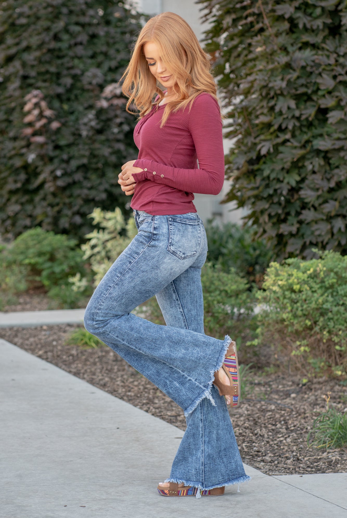 VERVET by Flying Monkey Jeans  This mid rise flare from VERVET is so fun with its frayed hem. Pair with heels and a blouse for a dressed up outlook. Skinny, 34" Inseam* Rise: Mid Rise, 9" Front Rise* Leg Opening: 25"* Material: 98% Cotton, 2% Spandex Stitching: Classic Fly: Zip Fly Style #: V2611 Contact us for any additional measurements or sizing. 