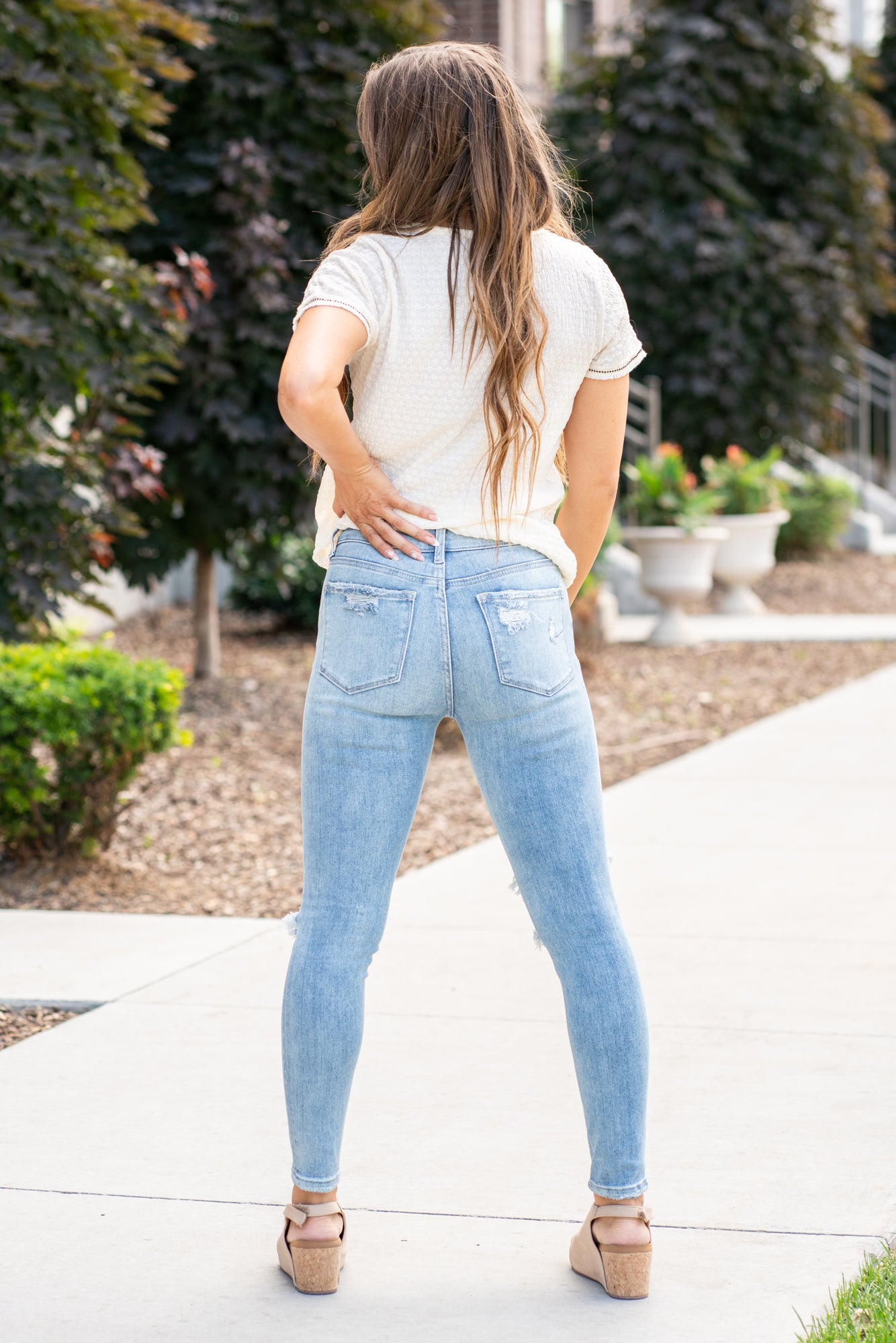 VERVET by Flying Monkey Jeans  This comfortable stretchy denim has a distressed detail, calf-hugging fit, fray hem bottom, and a 5 button-exposed fly with a distressed back pocket. Skinny Cut, 27" Inseam* Mid Rise, 9" Front Rise* 92%COTTON, 6%POLYESTER, 2%SPANDEX Machine Wash Separately In Cold Water Stitching: Classic Fly: Zipper Fly Style #: V2948 Contact us for any additional measurements or sizing.    *Measured on the smallest size, measurements may vary by size. 