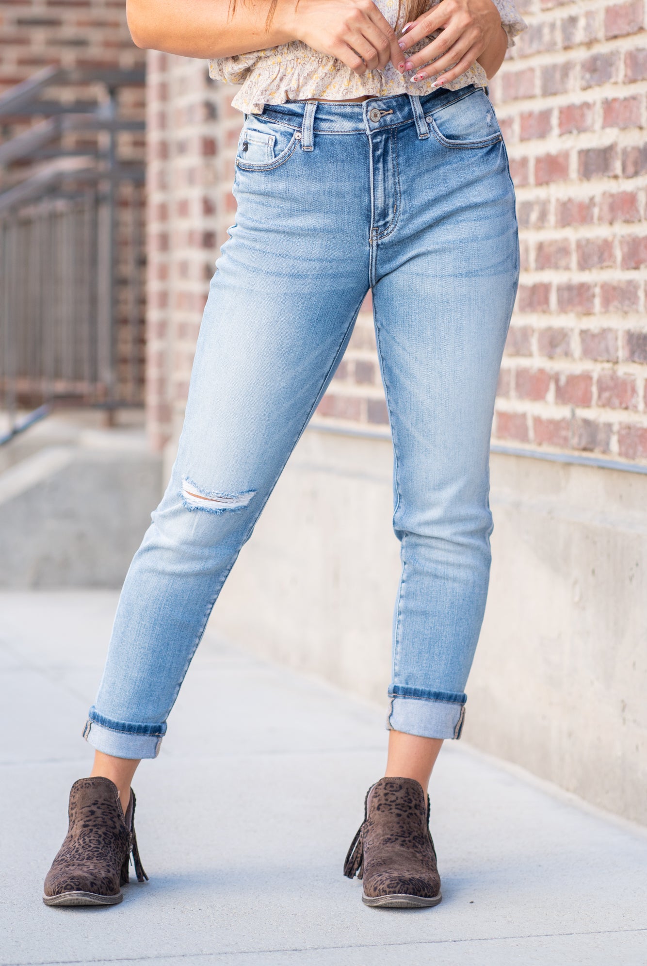 KanCan Jeans  These mom jeans will become your go-to! Pair these girlfriend mom fit with booties and a tee for an easy fall look.  Color: Medium Blue Wash Cut: Straight Fit, 26" Inseam Cuffed* Rise: High-Rise, 11" Front Rise* 94% COTTON , 5% POLYESTER , 1% SPANDEX Fly: Zipper Style #: KC9232M Contact us for any additional measurements or sizing.