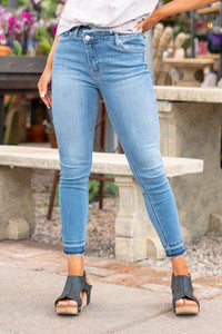 KanCan Jeans  These high-rise skinny jeans hit exactly the right spot on your waist and with some spandex, these will stretch as you wear and get super comfy!  Color: Medium Blue Wash Cut: Skinny, 27.5" Inseam* Rise: High Rise, 10.5" Front Rise* 93% COTTON , 6% POLYESTER , 1% SPANDEX Stitching: Classic Fly: Zipper  Style #: KC2554M *Measured on the smallest size, measurements may vary by size.  Contact us for any additional measurements or sizing.