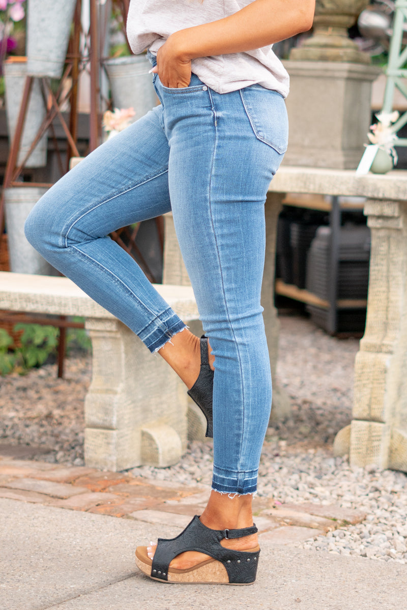 KanCan Jeans  These high-rise skinny jeans hit exactly the right spot on your waist and with some spandex, these will stretch as you wear and get super comfy!  Color: Medium Blue Wash Cut: Skinny, 27.5" Inseam* Rise: High Rise, 10.5" Front Rise* 93% COTTON , 6% POLYESTER , 1% SPANDEX Stitching: Classic Fly: Zipper  Style #: KC2554M *Measured on the smallest size, measurements may vary by size.  Contact us for any additional measurements or sizing.
