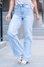 Flying Monkey Jeans  Comfort stretch denim and a slouchy fit make these cute 90s jeans a perfect statement piece.  Name: Mirror Wall Wash: Light Blue Cut: Flare Fit, 34" Inseam* Rise: High Rise, 11.5" Front Rise* 96.7% COTTON , 2.4% POLYESTER , .9% SPANDEX Fly: Zipper   Style #: F4437   Contact us for any additional measurements or sizing.   *Measured on the smallest size, measurements may vary by size. 