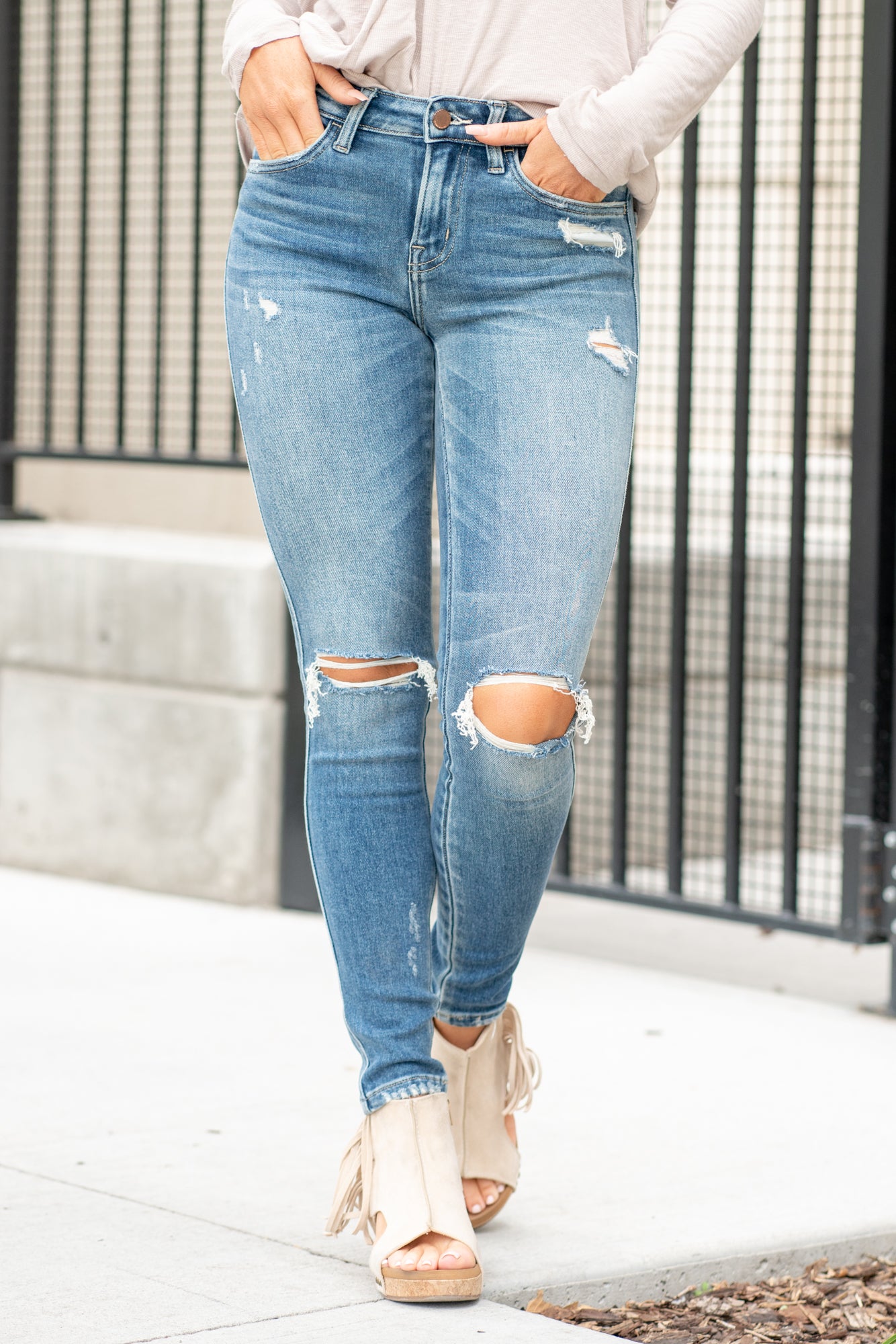 Wild World Mid Rise Distressed Ankle Skinny