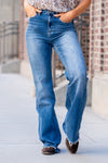 Flying Monkey Jeans  With comfortable stretch denim a fray hemline, these high-waisted and relaxed flares move with you. Features a cross-over button waistband and bell-bottom-styled legs.  Wash: Dark Blue Cut: Flare, 34" Inseam* Rise: High Rise, 11" Front Rise* 93% COTTON 5% POLYESTER 2% SPANDEX Stitching: Classic Fly: Zip Style #: F4511 Contact us for any additional measurements or sizing. 