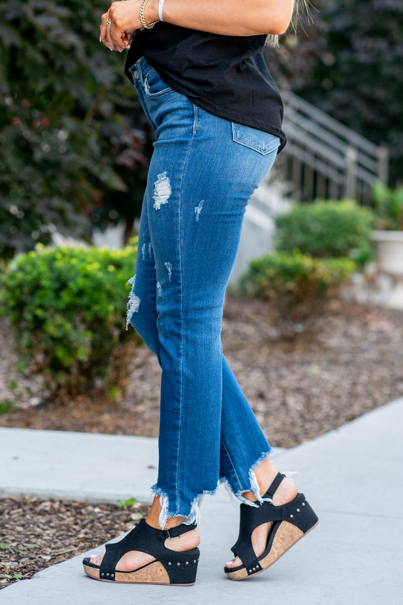 Judy Blue  Tired of your skinny jeans? These cute slim fits will be your favorites. With a shark bite destroyed hem and distressed legs, it's just enough detail to embellish your outfit. Color: Dark Blue  Cut: Slim fit, 28.5"* Mid Rise, 9.75" Front Rise* Material: 66%Cotton / 21% Poly / 11% Rayon / 2% Spandex Stitching: Classic Fly: Zipper Fly Style #: JB82403 | 82403 Contact us for any additional measurements or sizing. 