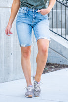 VERVET by Flying Monkey Jeans  These comfortable bermuda shorts have a distressed hem detail. Pair with a graphic tee and sandals. Shorts, 3.5" Inseam*   High Rise, 10" Front Rise* 98% Cotton, 2% Spandex Stitching: Classic Fly: Zipper  Style #: V2929 Contact us for any additional measurements or sizing.    *Measured on the smallest size, measurements may vary by size. 