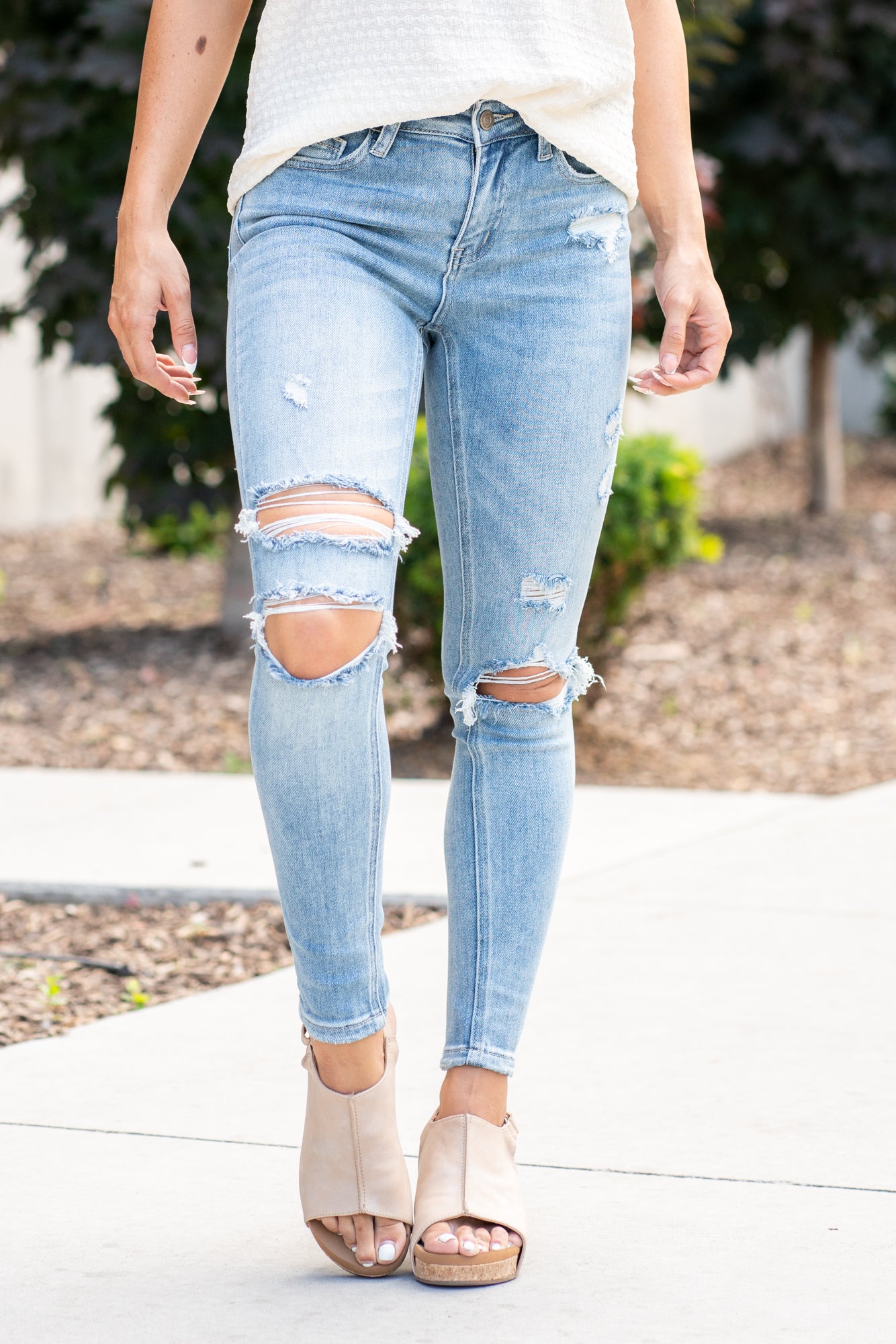 VERVET by Flying Monkey Jeans  This comfortable stretchy denim has a distressed detail, calf-hugging fit, fray hem bottom, and a 5 button-exposed fly with a distressed back pocket. Skinny Cut, 27" Inseam* Mid Rise, 9" Front Rise* 92%COTTON, 6%POLYESTER, 2%SPANDEX Machine Wash Separately In Cold Water Stitching: Classic Fly: Zipper Fly Style #: V2948 Contact us for any additional measurements or sizing.    *Measured on the smallest size, measurements may vary by size. 