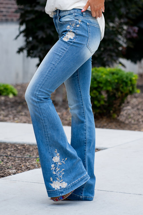 Miss Me  Wear these trouser hem flare cut jeans every day to bling up your wardrobe. Flare cut jeans featuring a 5 pocket design, whiskering, and crystal rivets. Wash: Medium Blue Inseam: 34" Flare Cut* High Rise, 9.5" Front Rise* Silver Buttons and Rivets  Cotton Blend Style #: H3851F Contact us for any additional measurements or sizing.    *Measured on the smallest size, measurements may vary by size. 