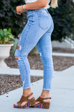 KanCan Jeans Color: Medium Blue Cut: Skinny, 27" Inseam Rise: Mid-Rise, 8.5" Front Rise 98% COTTON, 2% SPANDEX Stitching: Classic Fly: Zipper Style #: KC5056M  Contact us for any additional measurements or sizing.   *Measured on the smallest size, measurements may vary by size.  Jacquelyn wears a size 25 in jeans, a small in tops, and 6.5 in shoes. She is wearing size 25 in these jeans. 