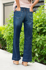 KanCan Jeans   KanCan Stretch Level: Comfort Stretch  Wide Leg Trouser Color: Dark Blue Wash Cut: Flare, 32" Inseam  Rise: High Rise, 11" Front Rise 99% COTTON, 1% SPANDEX Fly: Exposed Button Fly Style #: KC7126D  Contact us for any additional measurements or sizing.  *Measured on the smallest size, measurements may vary by size. 