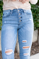 KanCan  KanCan Stretch Level: Stretchy Color: Medium Blue Wash Cut: Skinny, 27.5" Inseam* Rise: High-Rise, 9.5" Front Rise* 93% COTTON / ALGODON 6% POLYESTER / POLIESTER 1% SPANDEX / ELASTANE Stitching: Classic Fly: Exposed Button Fly Style #: KC9129M *Measured on the smallest size, measurements may vary by size.  Contact us for any additional measurements or sizing.   Alyssa is 5'5" and wears a size 25 in jeans, a small in tops, and 8 in shoes. She is wearing a size 25 in these jeans. 