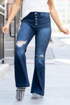 KanCan Jeans  Collection: Core Style Skinny, 31" Inseam  High Rise, 11.5" Front Rise Medium Blue Wash  95% COTTON, 4% POLYESTER, 1% LYCRA Fly: Exposed Button Fly Style #: KC8596D-PT Contact us for any additional measurements or sizing.  *Measured on the smallest size, measurements may vary by size.  Jacquelyn wears a size 25 in jeans, a small in tops, and 6.5 in shoes. She is wearing a size small in these overalls.