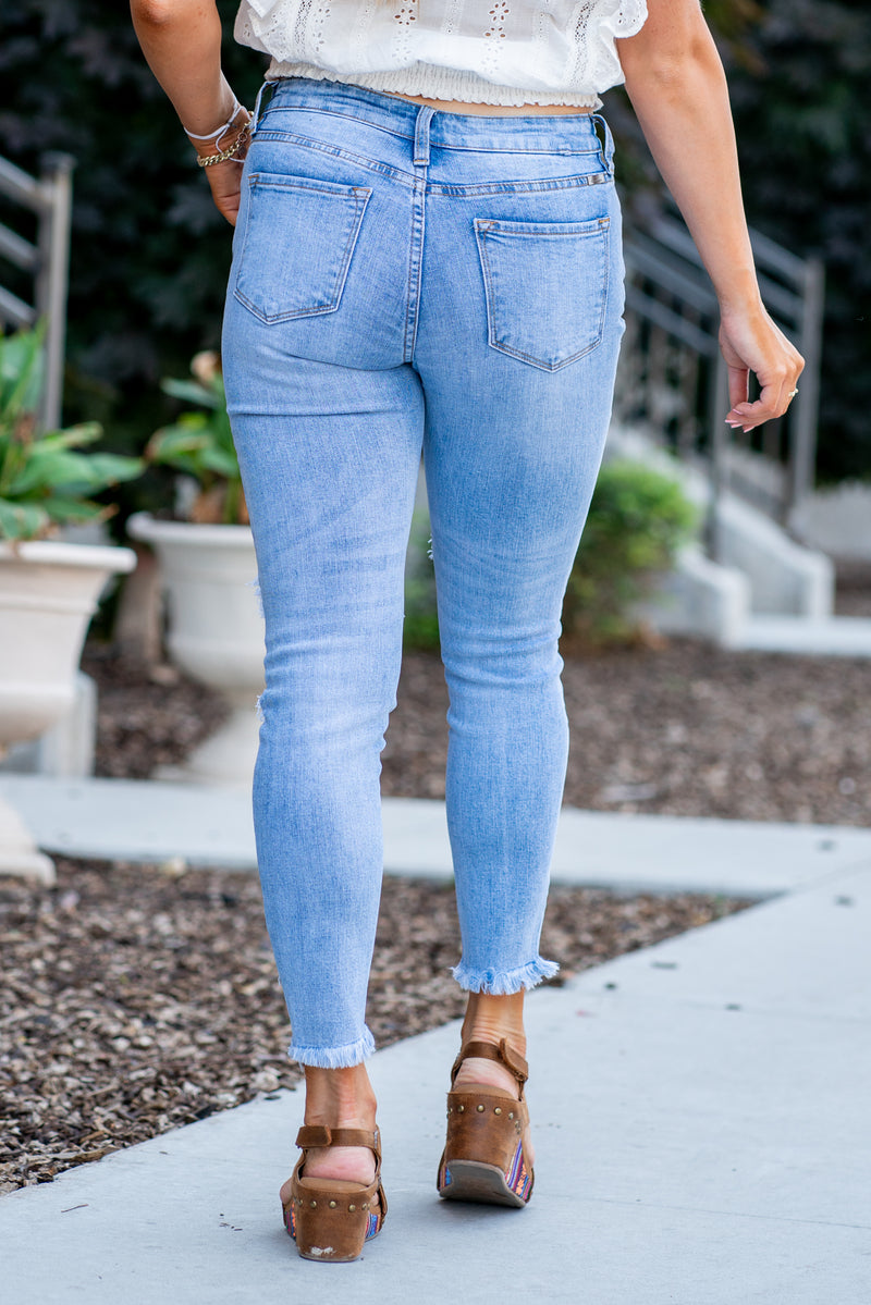 KanCan Jeans Color: Medium Blue Cut: Skinny, 27" Inseam Rise: Mid-Rise, 8.5" Front Rise 98% COTTON, 2% SPANDEX Stitching: Classic Fly: Zipper Style #: KC5056M  Contact us for any additional measurements or sizing.   *Measured on the smallest size, measurements may vary by size.  Jacquelyn wears a size 25 in jeans, a small in tops, and 6.5 in shoes. She is wearing size 25 in these jeans. 