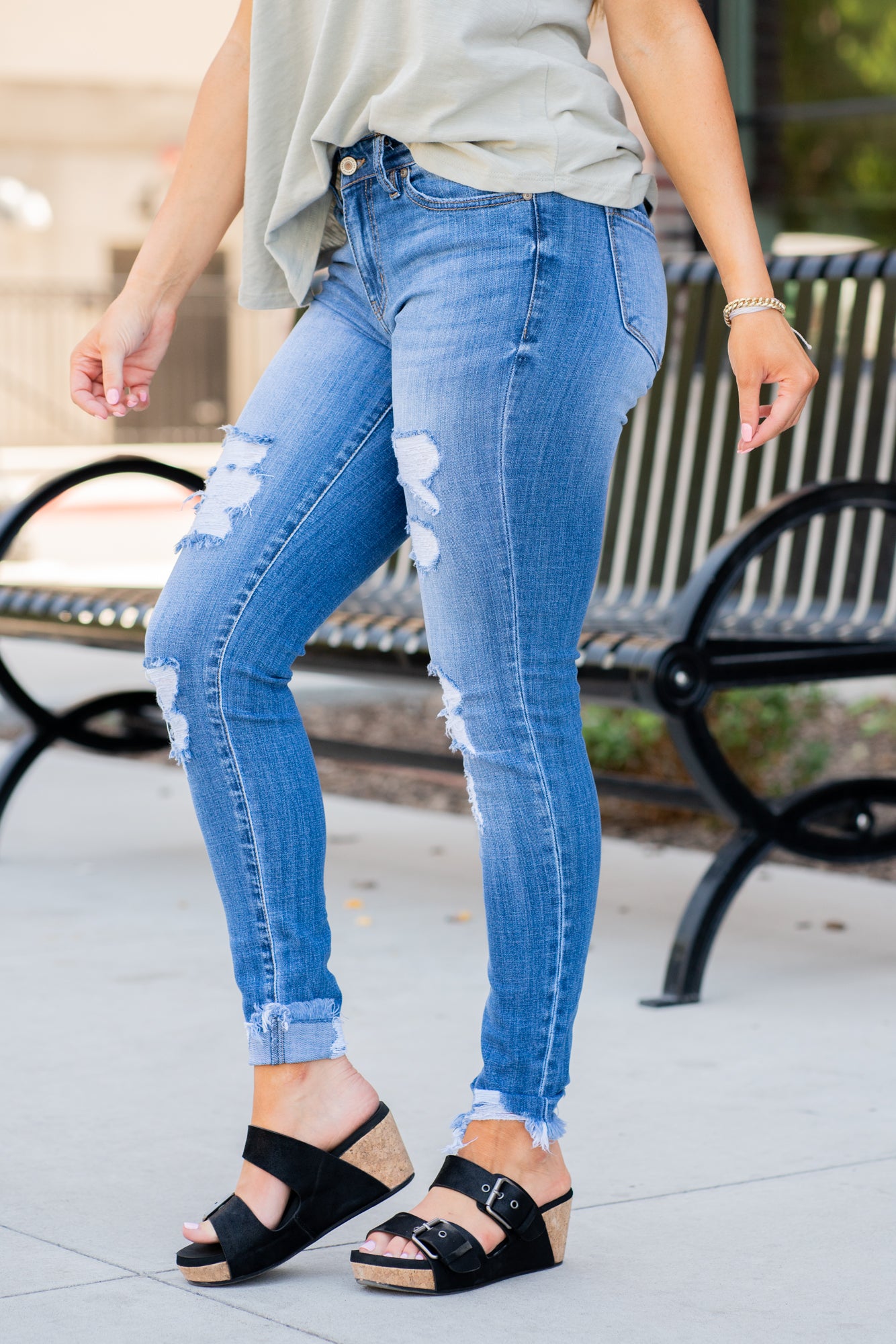 KanCan Jeans Collection: Core Collection Color: Medium Wash, 99% COTTON 1% SPANDEX Cut: Skinny, 29" Inseam* Rise: Mid-Rise, 8.5" Front Rise* Machine Wash Separately In Cold Water Stitching: Classic Fly: Zipper Style #: KC7103M Contact us for any additional measurements or sizing.  *Measured on the smallest size, measurements may vary by size.    Jacquelyn wears a size 25 in jeans, a small in tops, and 6.5 in shoes. She is wearing size 25 in these jeans.