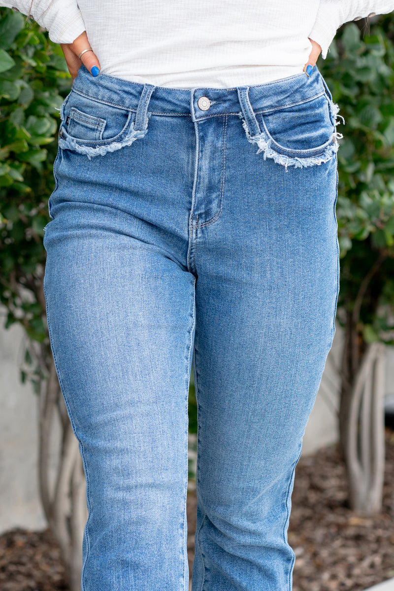 Judy Blue  Tired of your skinny jeans? These cute slim fits will be your favorites. With a fringe fray seam detail, it's just enough detail to embellish your outfit. Color: Medium Blue  Cut: Straight fit, 28.5" Inseam* High Rise, 11" Front Rise* Material: 94% COTTON, 5% POLYESTER, 1% SPANDEX Stitching: Classic Fly: Zipper Fly Style #: JB88473 | 88473  Contact us for any additional measurements or sizing.  *Measured on the smallest size, measurements may vary by size.