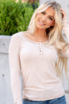 This long sleeve Henley top is great for layering up or down during winter and pairs well with any denim.  Color: Beige Button Up Front Henley with Button Sleeve Detail Neckline: Round Sleeve: Long Sleeve Self - 60% POLYESTER/32% COTTON/8% SPANDEX Style #: JAT7559-Beige Contact us for any additional measurements or sizing.