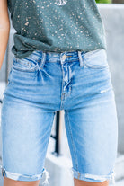 VERVET by Flying Monkey Jeans  These comfortable bermuda shorts have a distressed hem detail. Pair with a graphic tee and sandals. Shorts, 3.5" Inseam*   High Rise, 10" Front Rise* 98% Cotton, 2% Spandex Stitching: Classic Fly: Zipper  Style #: V2929 Contact us for any additional measurements or sizing.    *Measured on the smallest size, measurements may vary by size. 