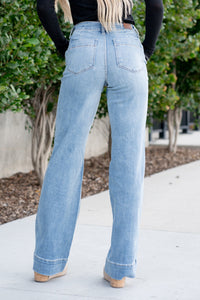 Judy Blue  These mid-rise jeans hit the right spot on your waist! With a medium blue wash and trouser hem, these will be your favorite denim to dress up. Color: Medium Blue Wash Cut: Wide Leg Flare, 33.5" Inseam* Rise: Mid-Rise. 9.75" Front Rise* Material: 66% COTTON,12% RAYON,21% POLYESTER,1% SPANDEX Stitching: Classic  Fly: Zipper Style #: JB88401-PL | 88401-PL *Measured on the smallest size, measurements may vary by size.  Contact us for any additional measurements or sizing.