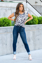 Judy Blue  A dark wash mid-rise skinny with a folded hem that can be unfolded to add length for longer inseams. Color: Medium Blue  Cut: Skinny fit, 28.5" Cuffed* | 32" Inseam Uncuffed* Mid Rise, 9.75" Front Rise* Material: 52% Cotton, 23% Polyester, 22% Rayon, 3% Spandex Stitching: Classic Fly: Zipper Fly Style #: JB82340 | 82340 Contact us for any additional measurements or sizing.    *Measured on the smallest size, measurements may vary by size.   