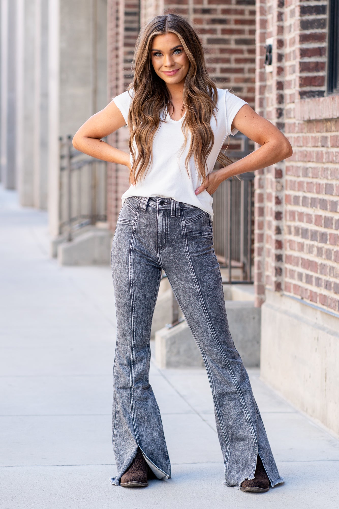 KanCan Jeans    Fray hem with a split hem and a front seam with a high waist.  Color: Grey Wash  Cut: Flare, 33" Inseam  Rise: High Rise, 11.5" Front Rise 99% COTTON , 1% SPANDEX Fly: Zipper Fly Style #: KC9314GR Contact us for any additional measurements or sizing.    *Measured on the smallest size, measurements may vary by size. 