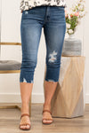 KanCan Jeans Collection: Spring 2021 Color: Dark Wash High Rise Fray Hem Cut: Skinny Capris, 16" Inseam Rise: High-Rise, 10" Front Rise 68%COTTON 30%POLYESTER 2%SPANDEX Stitching: Classic  Fly: Zipper Fly Style #: KC8622D Contact us for any additional measurements or sizing.  Kristin wears a size small top, a 3 in jeans, and a 7 in shoes. She is wearing a size 25/3 in these jeans.