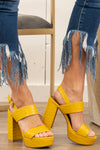 Strappy Heeled Sandals by Mi.iM  A chunky heel gives off retro vibes for on-trend dressing. Last but not least, a wrap-around ankle wrap looks just as stylish while providing wearable stability to this sky high design. Mustard Man-made Upper Padded footbed  Contact us for any additional measurements or sizing. 